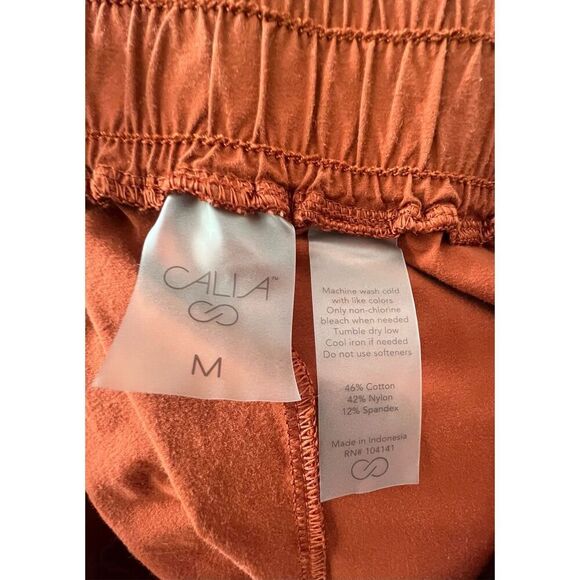 CALIA By Carrie Underwood Burnt Orange Workout Stretchy Shorts - Picture 3 of 4